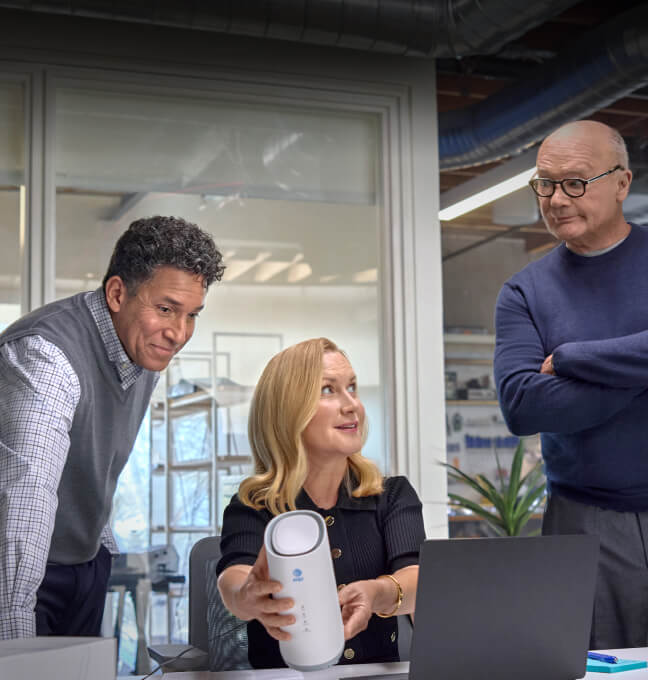 Team collaborating and staying connected with AT&T Business features like plug and play internet