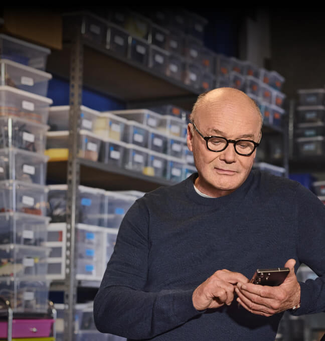 Man on wireless device connected through AT&T wireless plans for business
